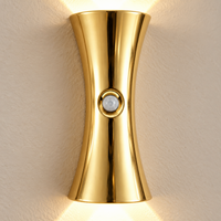 Close-up of the gold hourglass body and faceted central motion sensor