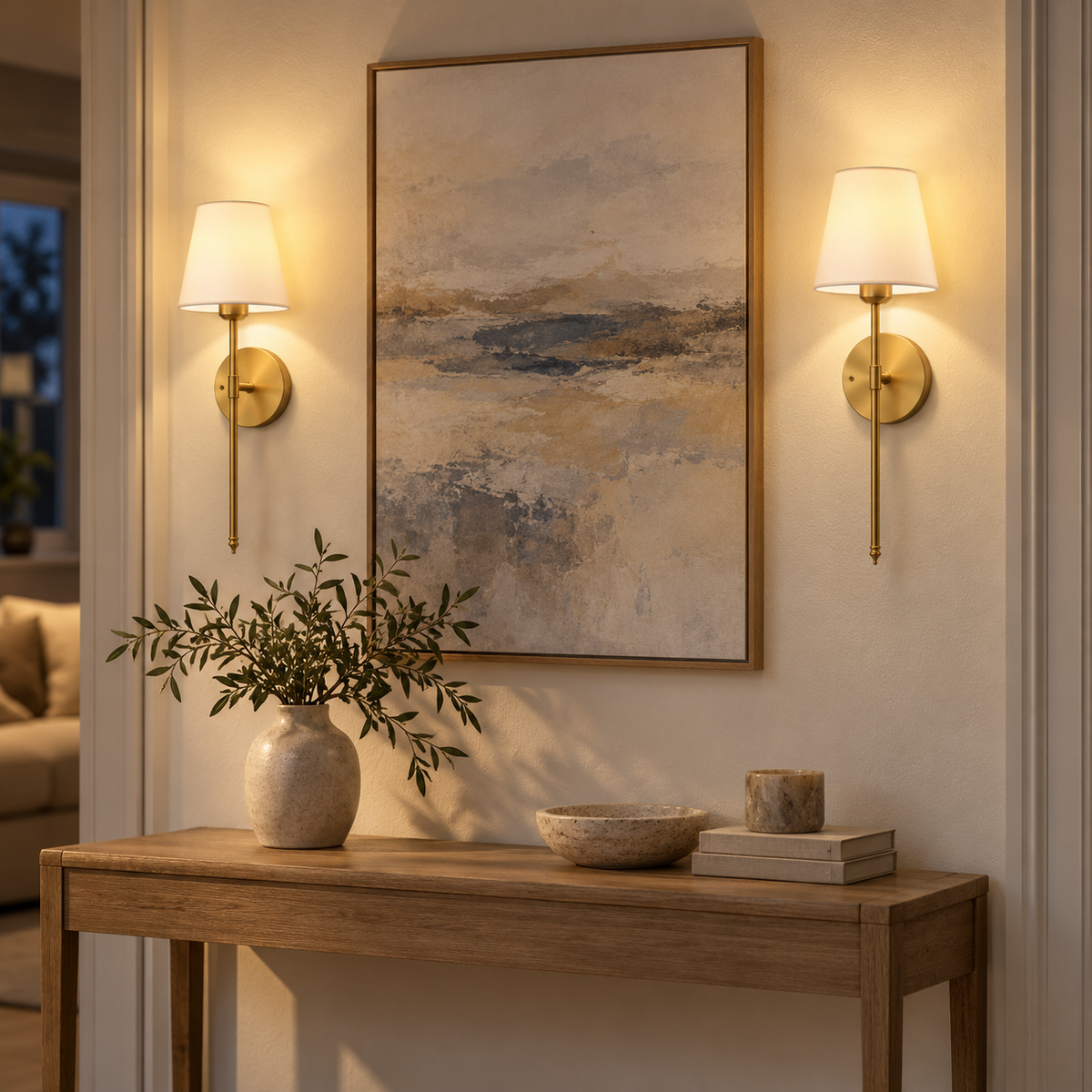 Two rechargeable gold wall sconces lighting a warm living room wall