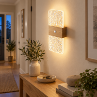 Wood-effect motion wall light illuminating a warm cream hallway