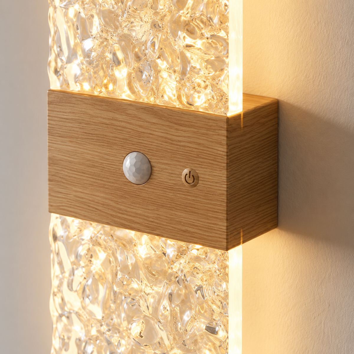 Close-up of the wood-effect housing, motion sensor, power button and diffusers